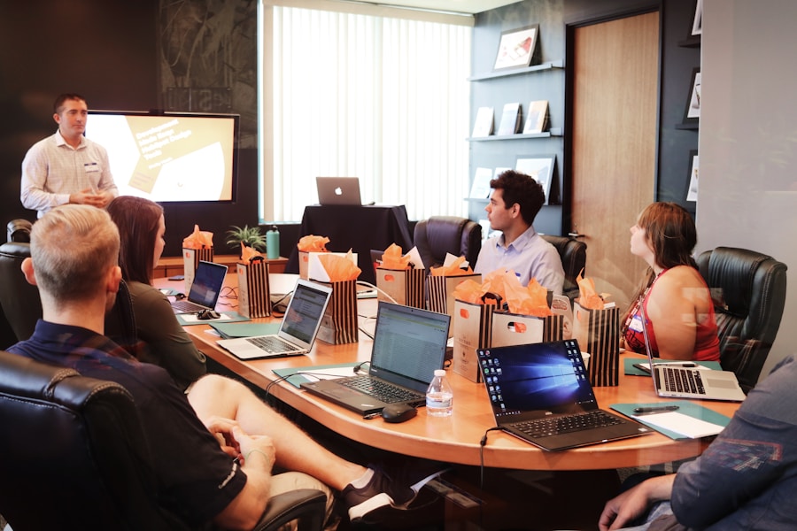 People planning product work with notes and laptops